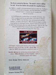 Back cover of a dog-eared "New Adventures"